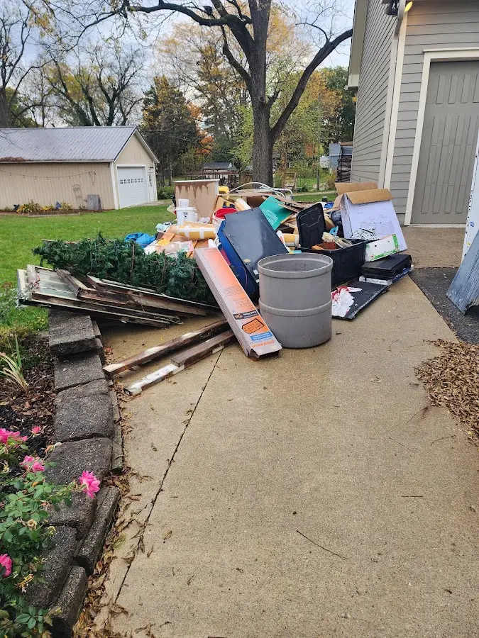 Dumpster being loaded with debris for Estate Cleanout Dumpster Rental in Jefferson Hills